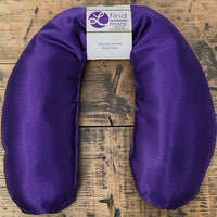 Herbal lavender neck wrap resting on shoulders